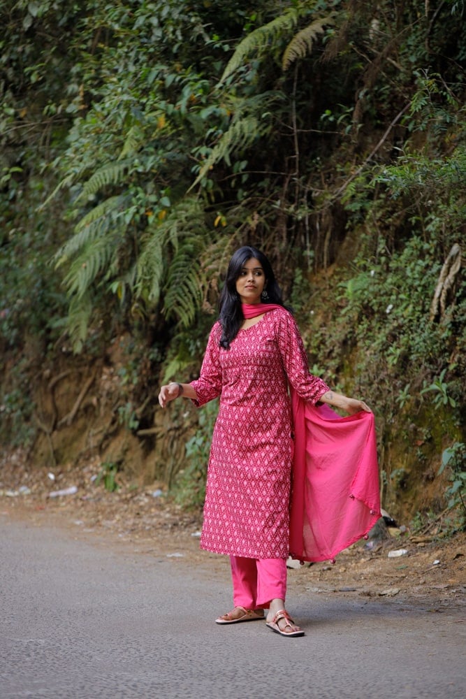 Nardana pink - ikkat cotton suit set in pink with kota doria dupatta with Ikkat potli tassels