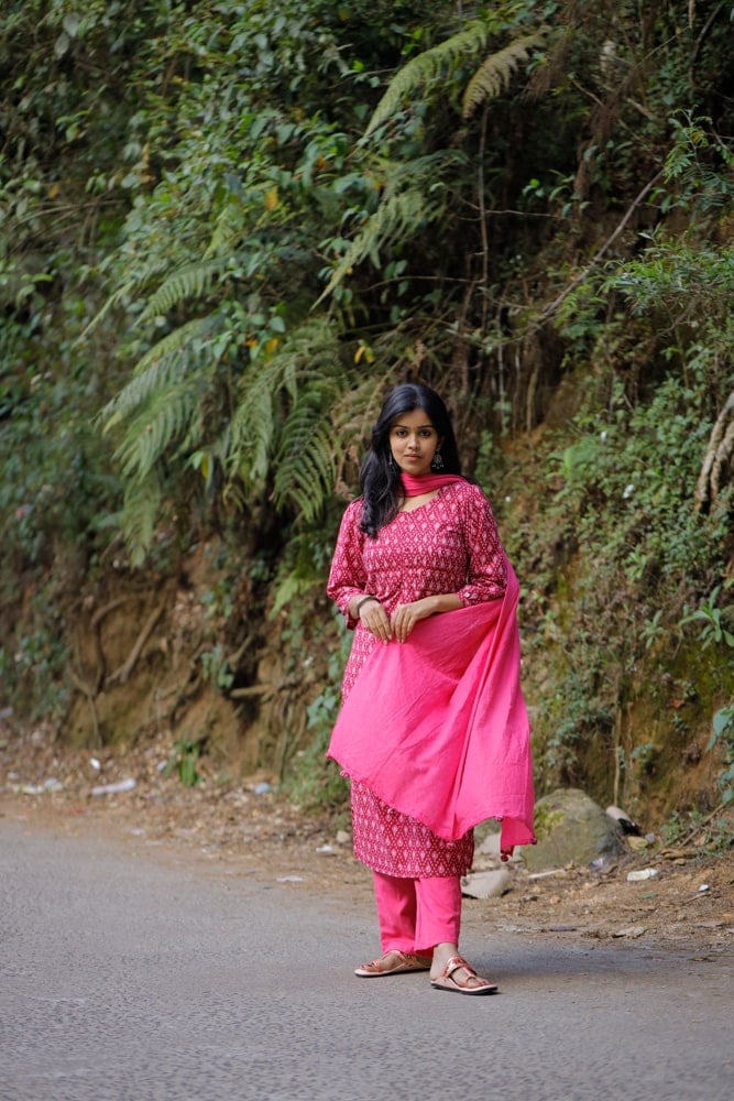 Nardana pink - ikkat cotton suit set in pink with kota doria dupatta with Ikkat potli tassels
