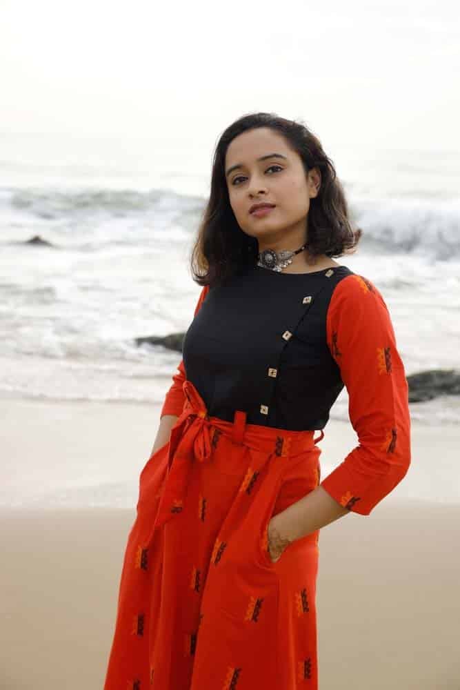 Dress 17 - Handloom cotton with thread motifs dress along with belt in fanta orange