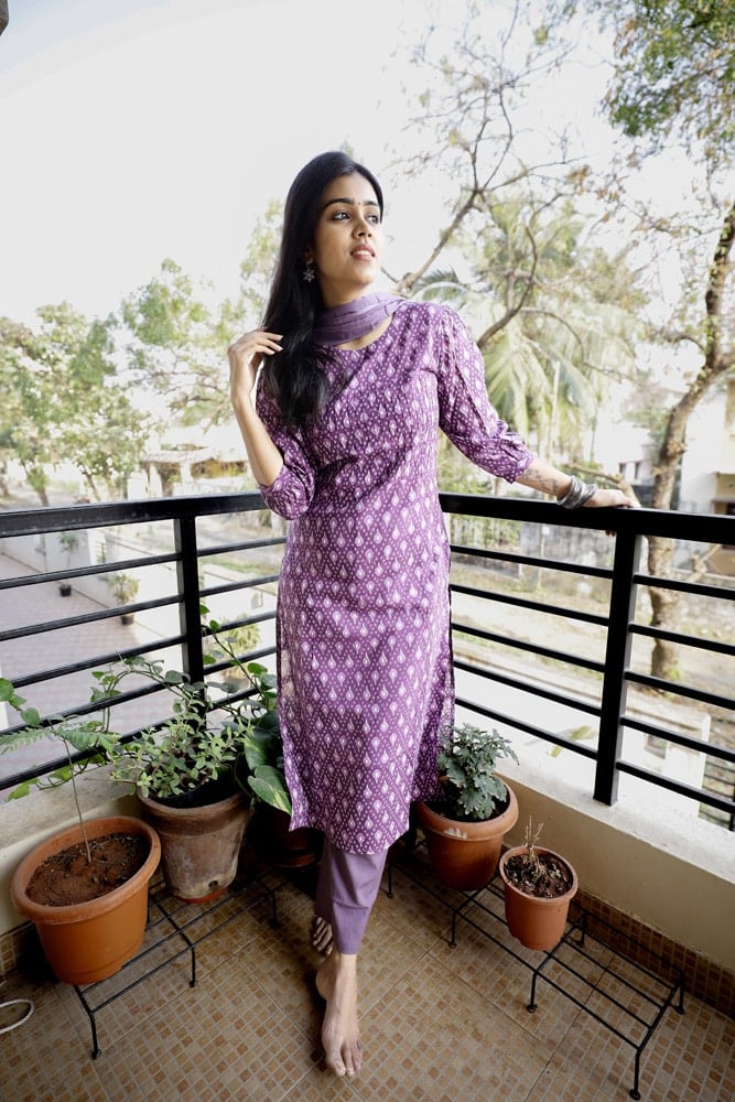 Nardana - ikkat cotton suit set in purple with kota doria dupatta with Ikkat potli tassels