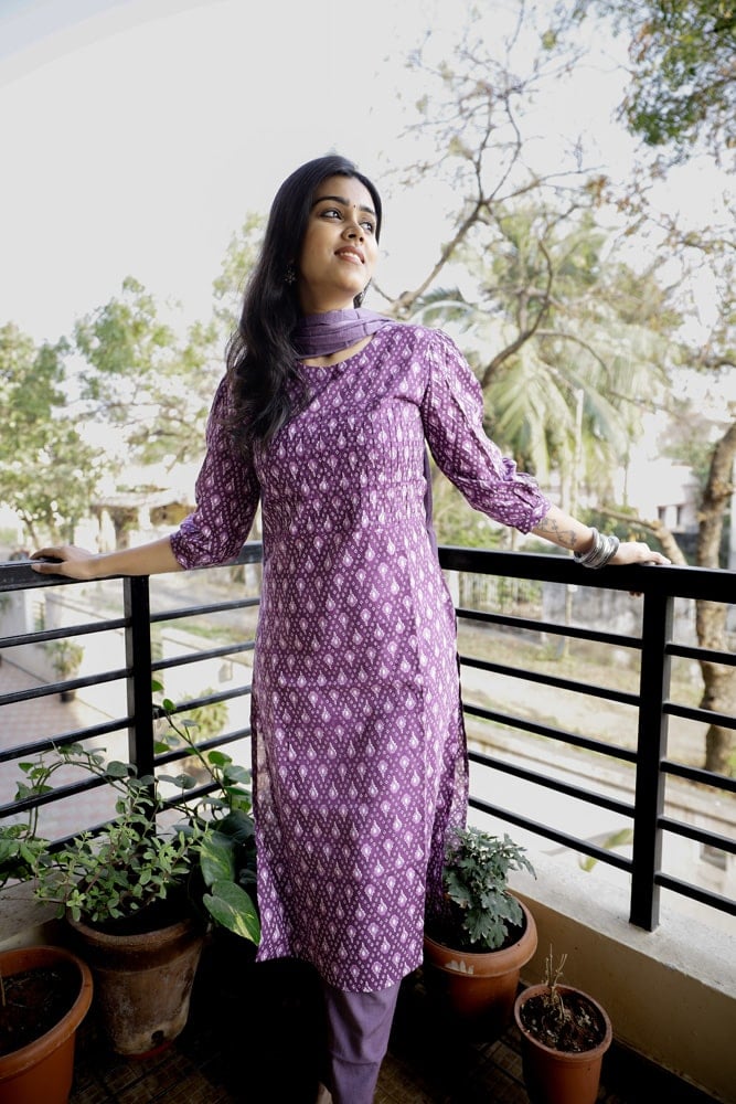 Nardana - ikkat cotton suit set in purple with kota doria dupatta with Ikkat potli tassels