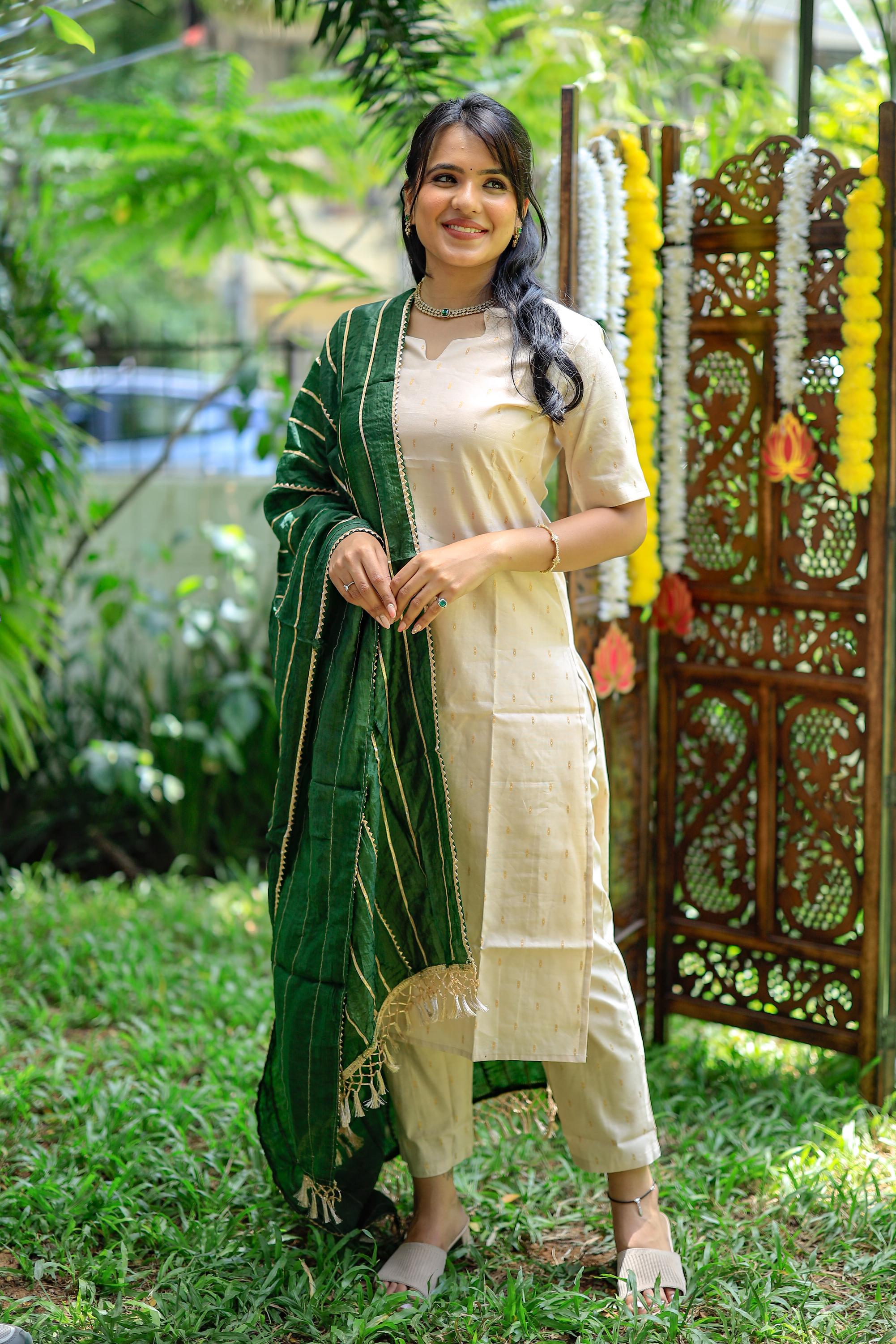 Tapsee ( cream ) - silk by cotton suit set with a gota heavy silk dupatta in cream and green