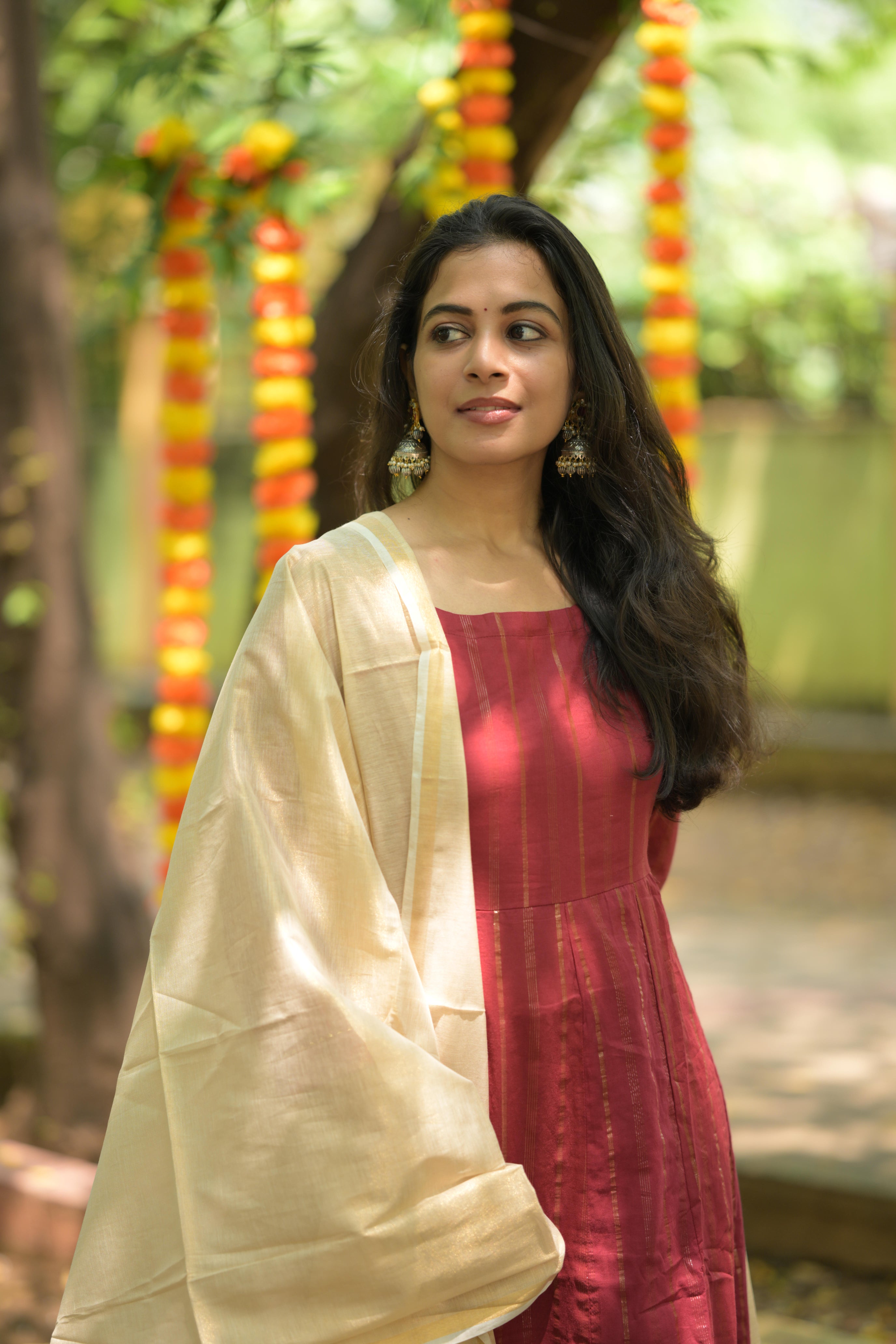 Keerthana - lurex cotton anarkali suit set with a gold colour silk cotton dupatta with tassels.